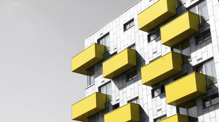 Modern apartments Modern apartments with balconies set against a blue sky